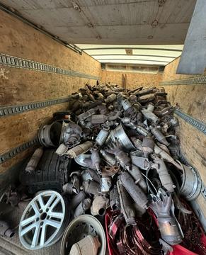 SMASH Recycling | Pile of Catalytic Converters and Scrap Metal in a Trailer