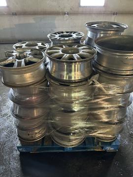 Stacked Aluminum Wheels Ready for Recycling at Smash Recycling
